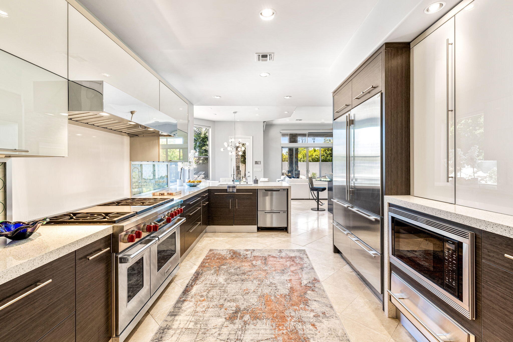 28 Clancy Lane South Rancho Mirage, CA 92270 - Photo 24 of 78 a kitchen with stainless steel appliances granite countertop a stove and a sink
