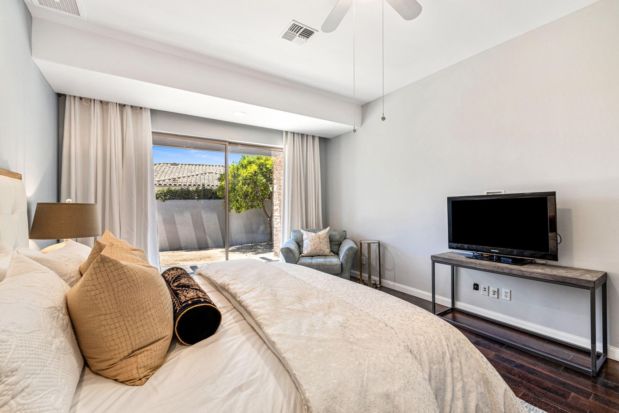 28 Clancy Lane South Rancho Mirage, CA 92270 - Photo 48 of 78 a bedroom with a bed and a flat tv screen on dresser