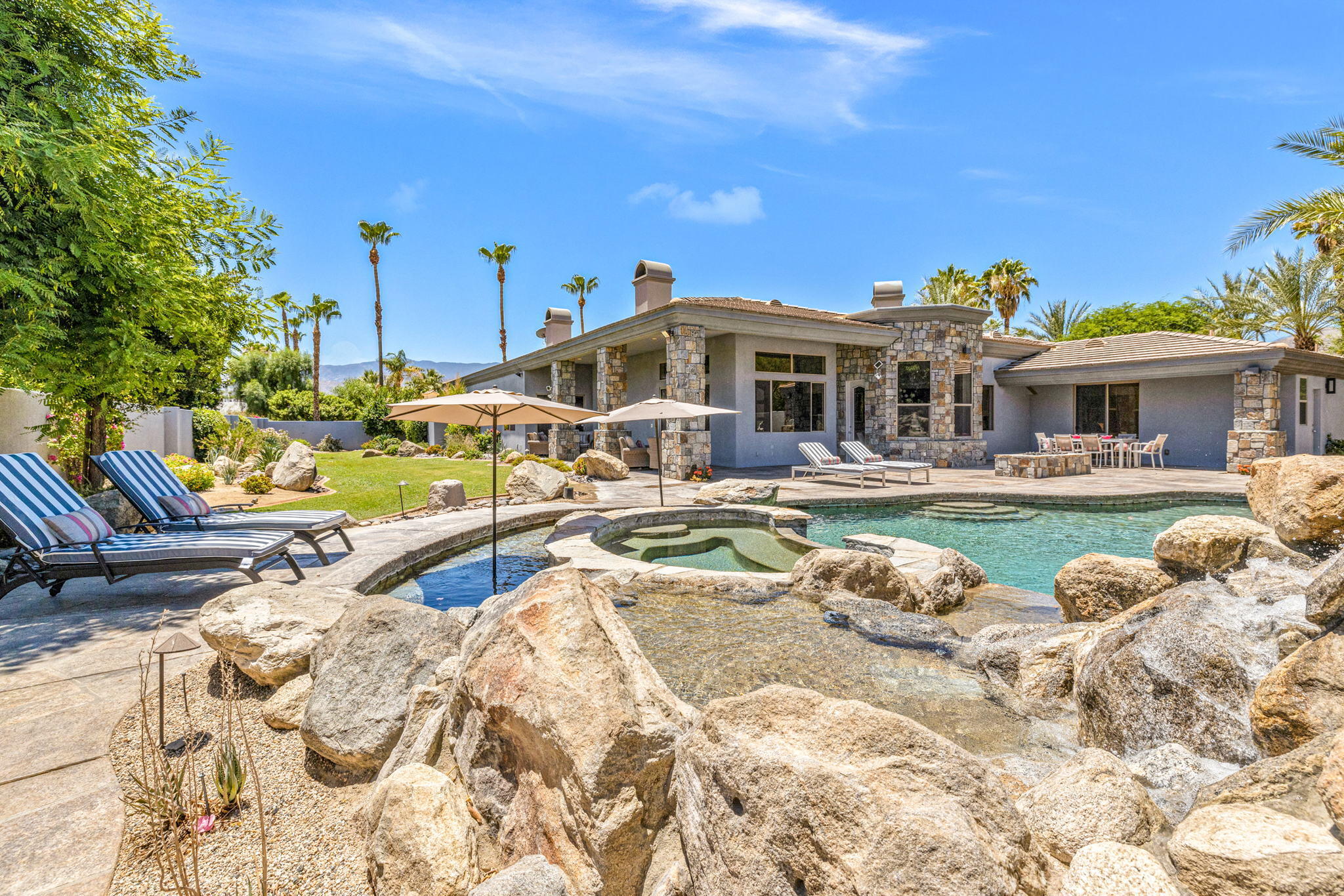 28 Clancy Lane South Rancho Mirage, CA 92270 - Photo 67 of 78 a view of a house with swimming pool and sitting area