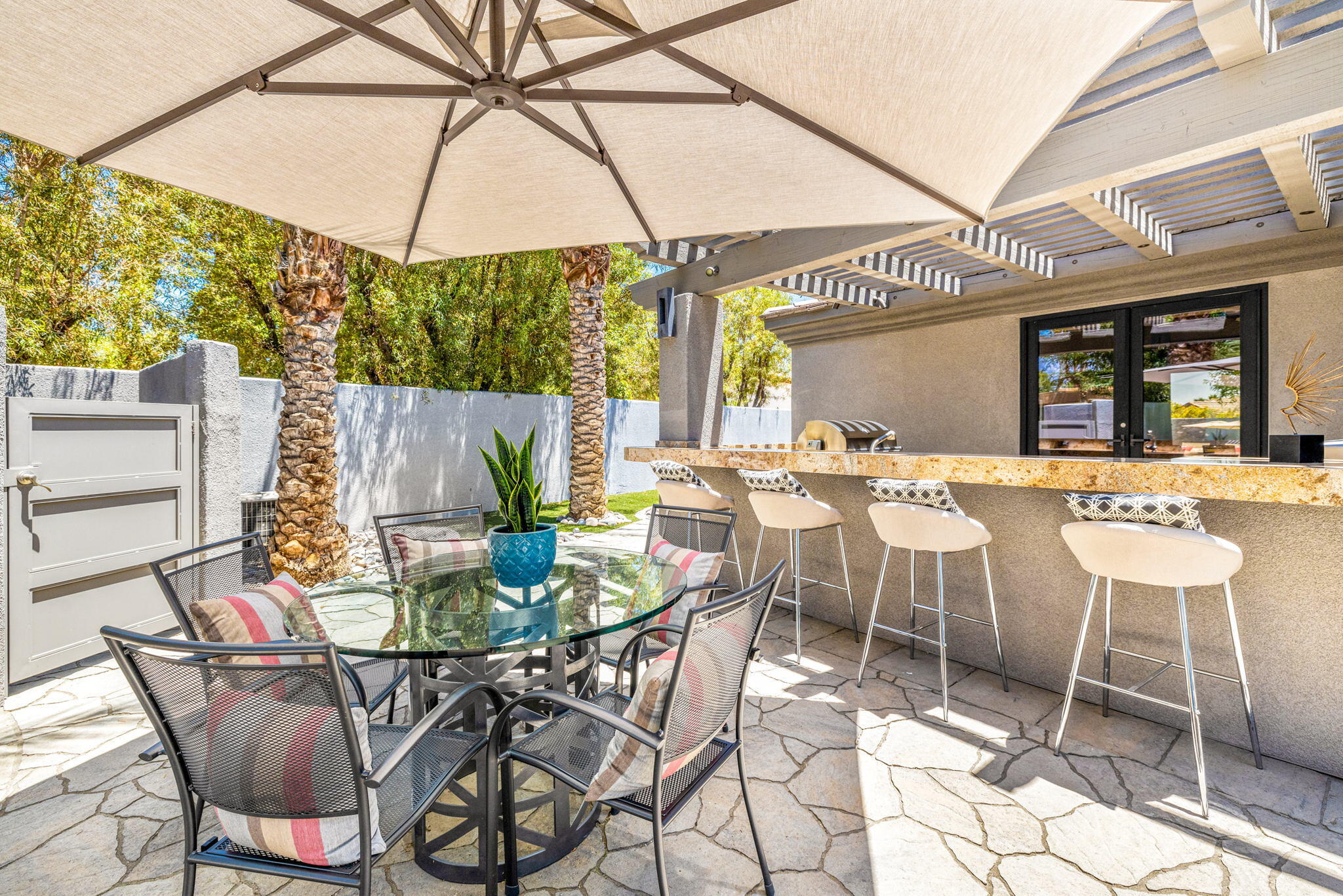 28 Clancy Lane South Rancho Mirage, CA 92270 - Photo 71 of 78 a view of an outdoor dining space with a table and chairs