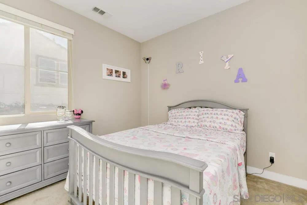 7508 Eagle Drive Santee, CA 92071 - Photo 12 of 25 a bedroom with a bed and a window