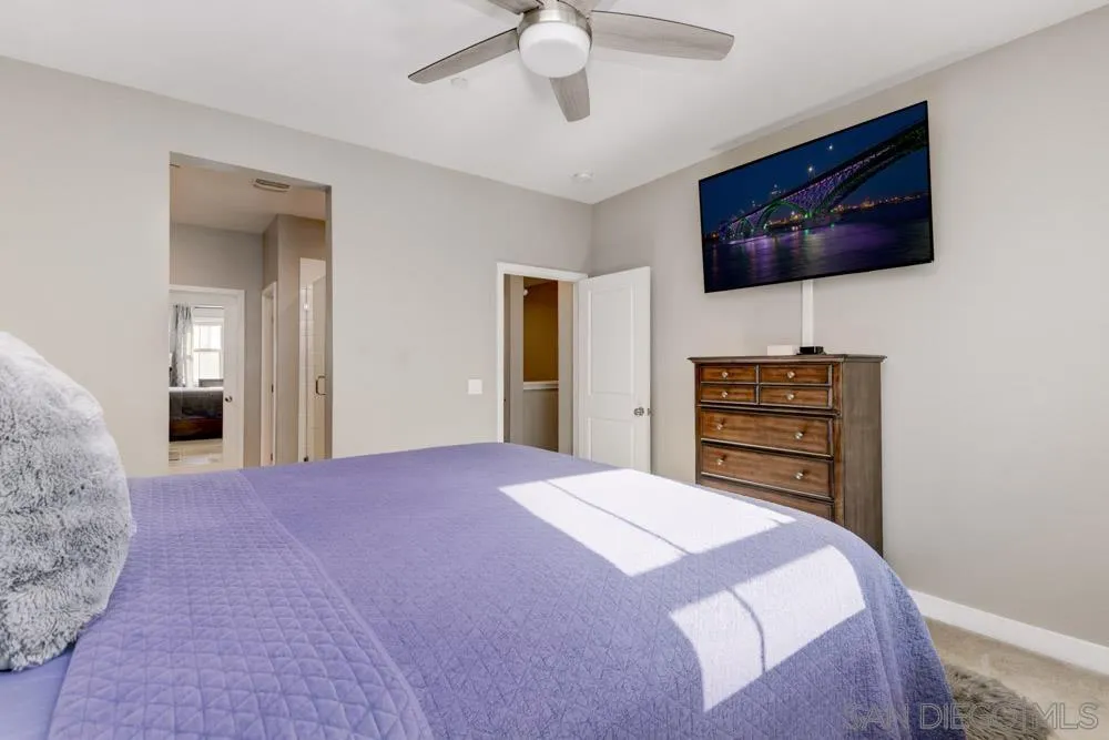 7508 Eagle Drive Santee, CA 92071 - Photo 19 of 25 a bedroom with a bed and a flat screen tv