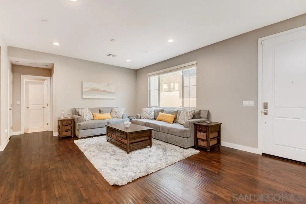 7508 Eagle Drive Santee, CA 92071 - Photo 4 of 25 a living room with furniture and a wooden floor