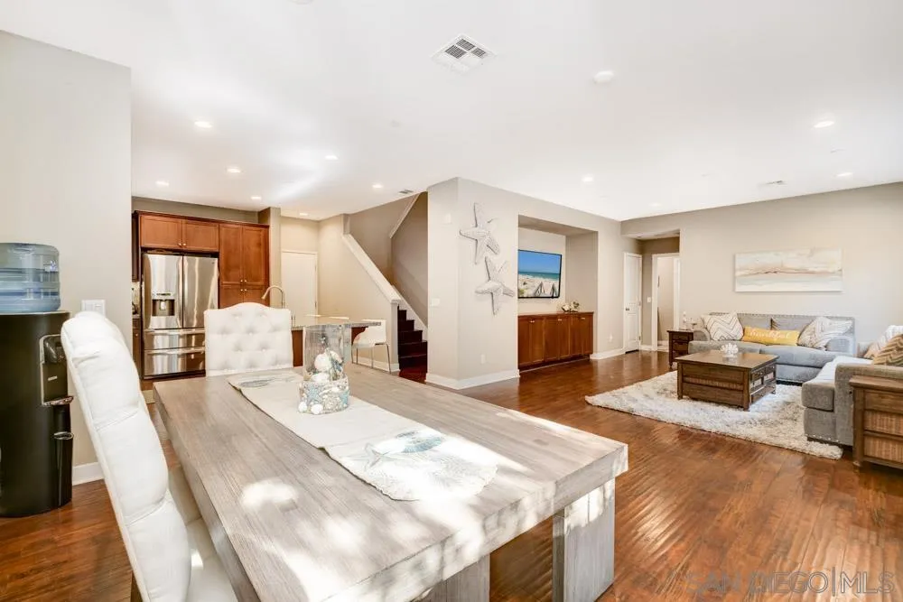 7508 Eagle Drive Santee, CA 92071 - Photo 7 of 25 a living room with fireplace furniture and a wooden floor