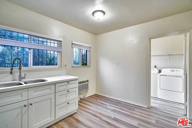 a kitchen with a sink and cabinets