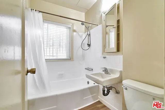 a bathroom with a sink a toilet and a bathtub