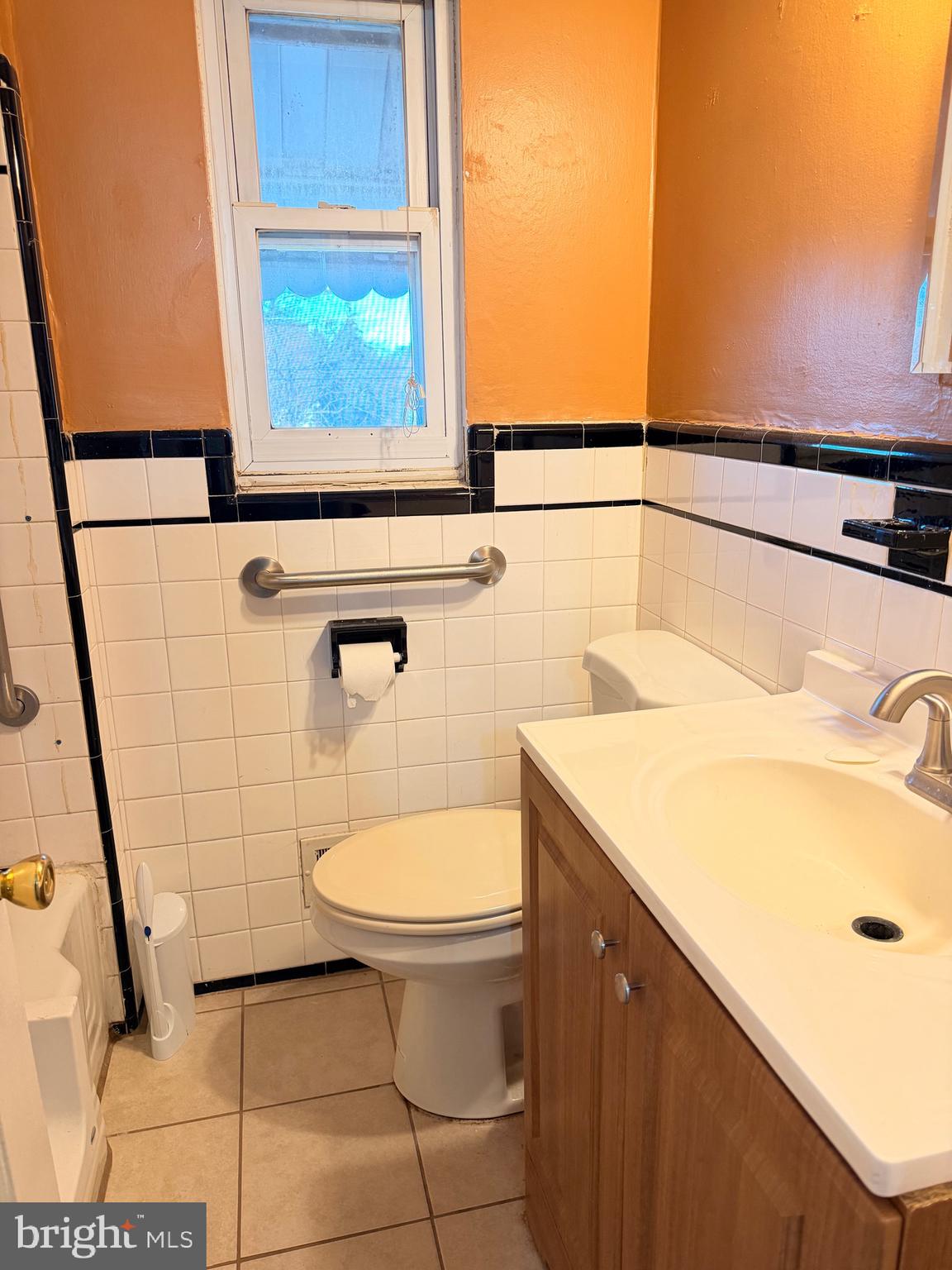 1001 30th Street Southeast Washington, DC 20019 - Photo 12 of 40 a bathroom with a sink a toilet and vanity