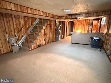 a bathroom with a toilet and a shower curtain