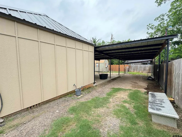 a view of backyard with cabin