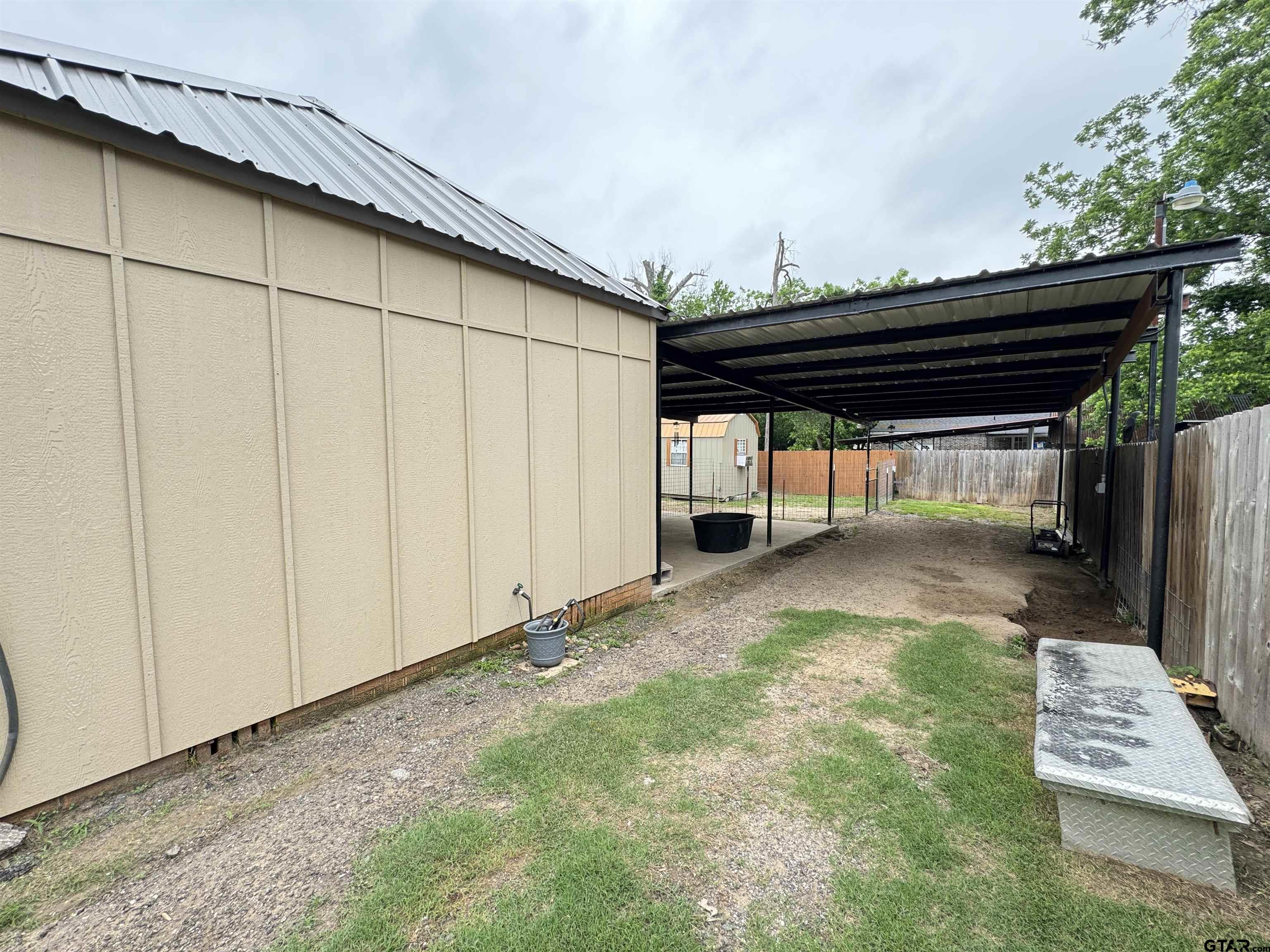 216 Rogers Avenue Henderson, TX 75654 - Photo 16 of 20 a view of backyard with cabin