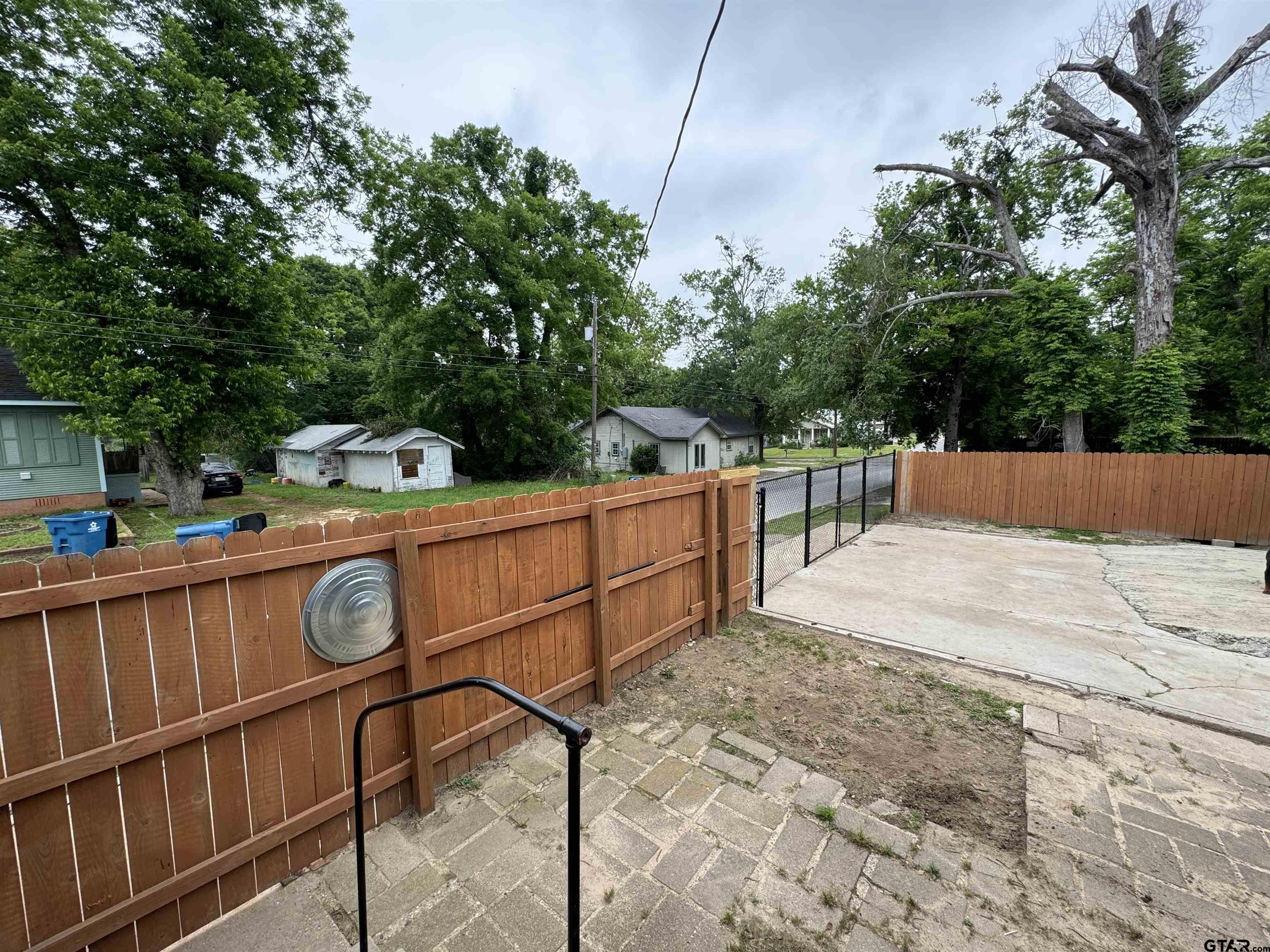 216 Rogers Avenue Henderson, TX 75654 - Photo 18 of 20 a view of a backyard with sitting area