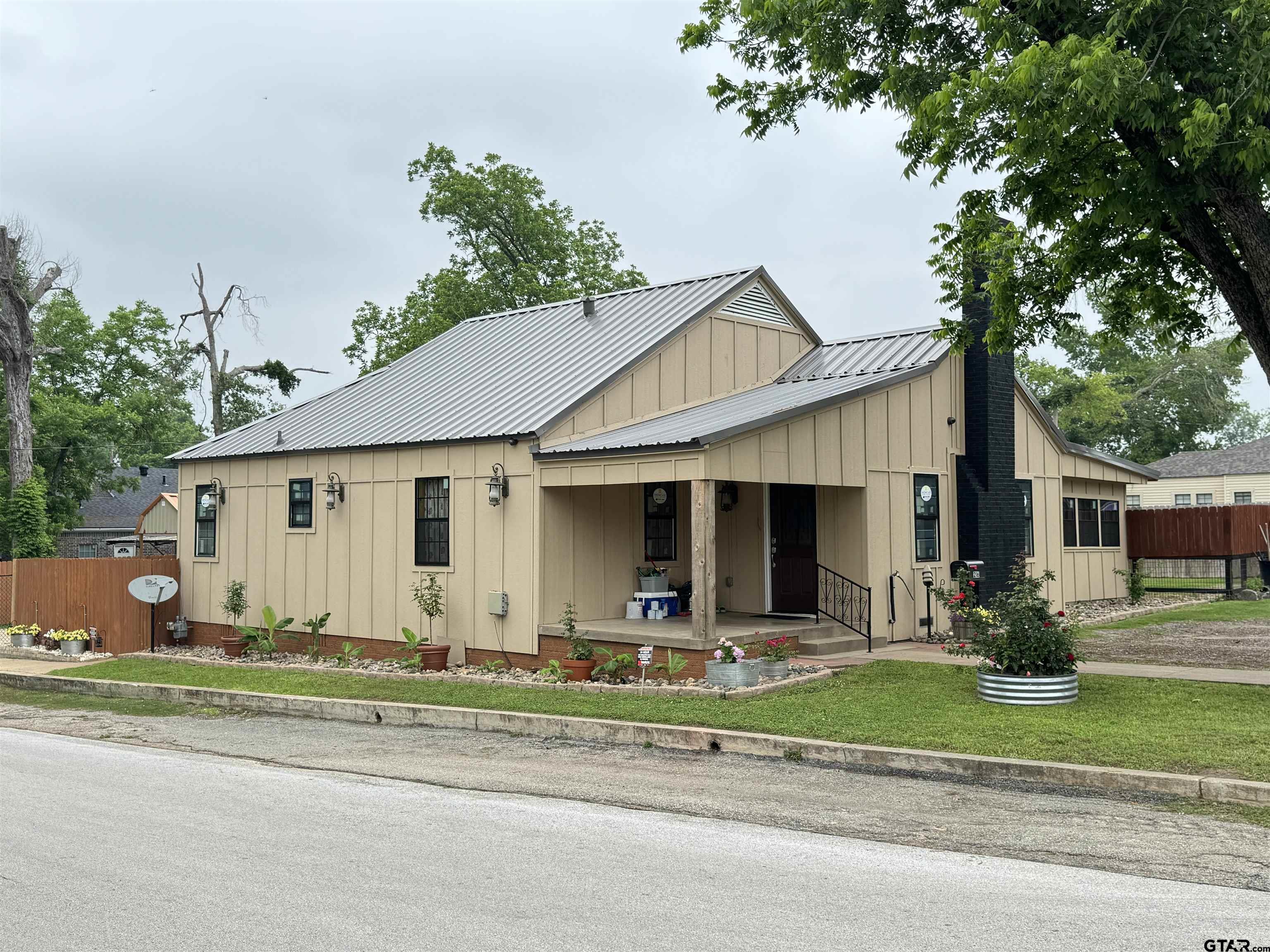 216 Rogers Avenue Henderson, TX 75654 - Photo 20 of 20 a front view of a house with garden