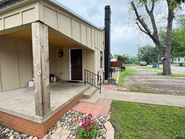 a view of a porch with a floor to ceiling windows