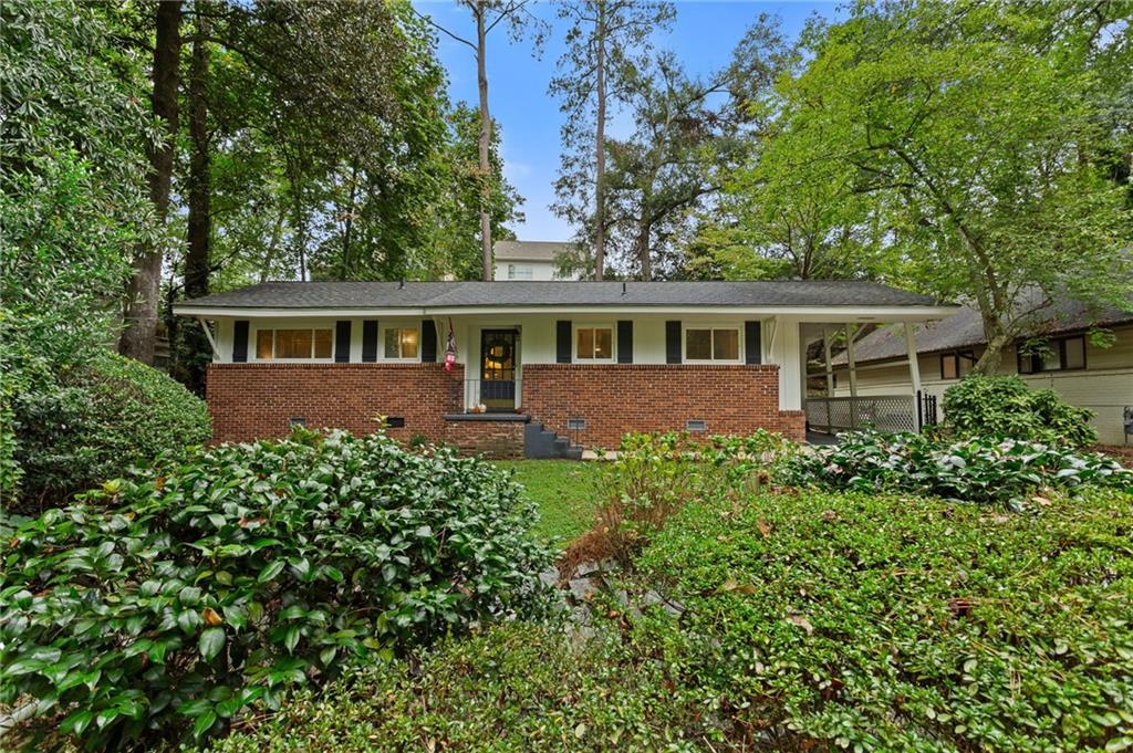 front view of a house with a garden