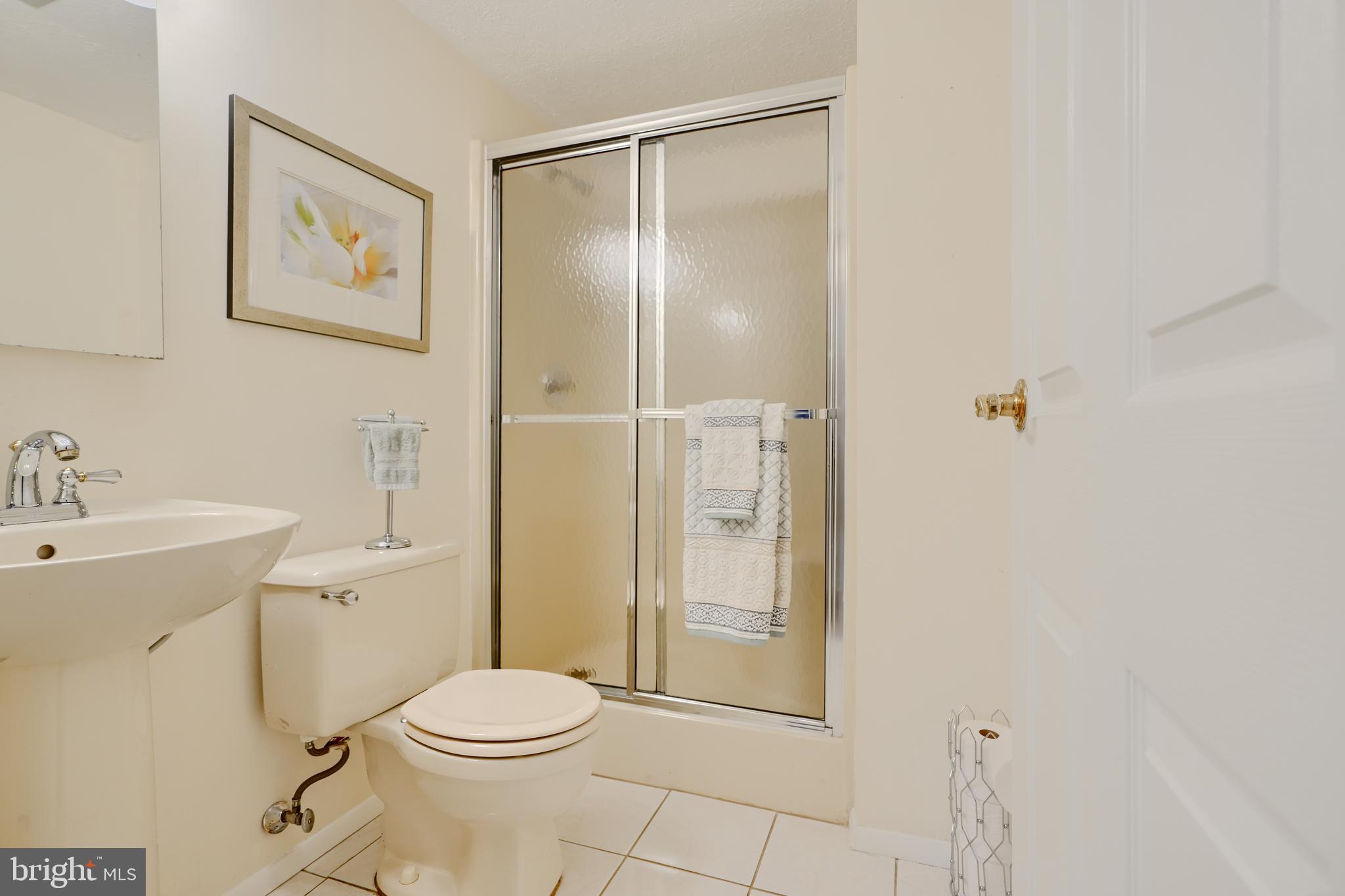 19 Yew Road Baltimore, MD 21221 - Photo 33 of 36 a bathroom with a toilet sink and shower