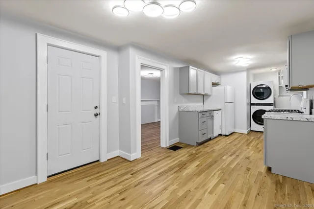 a room with a bed and cabinets