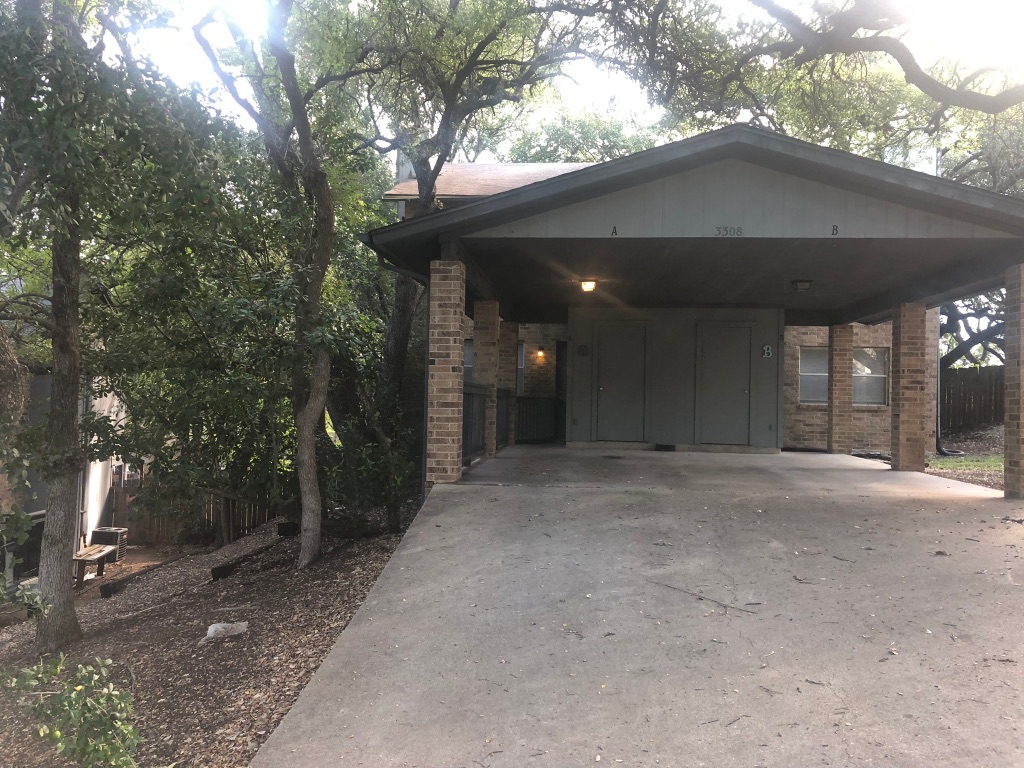 3308 Dunliegh Drive, Unit A Austin, TX 78745 - Photo 1 of 10 a view of a house with a tree