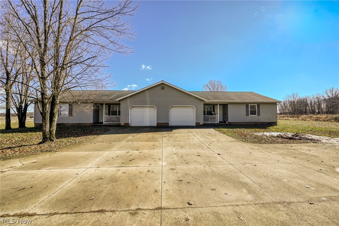 8464-8446 Tallmadge Road Diamond, OH 44412 - Photo 2 of 39 Ranch-style house with a garage and concrete driveway
