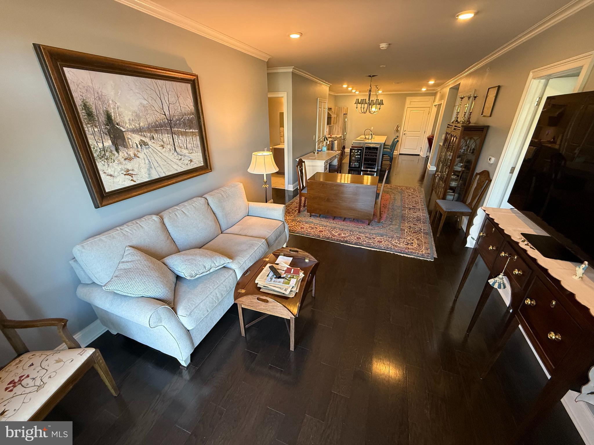 200 North Sycamore Street, Unit 2I Newtown, PA 18940 - Photo 11 of 27 a living room with furniture and a flat screen tv
