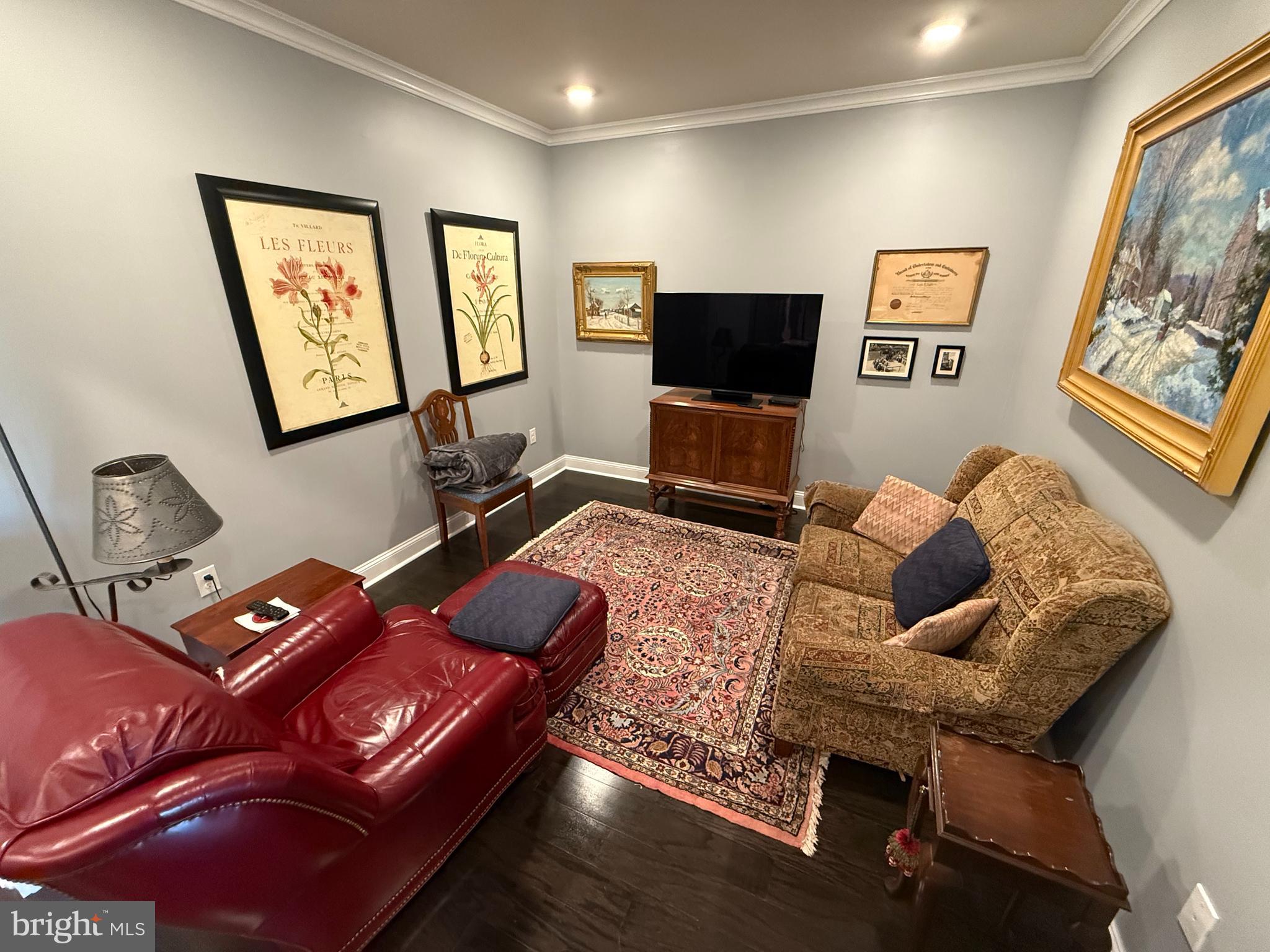 200 North Sycamore Street, Unit 2I Newtown, PA 18940 - Photo 13 of 27 a living room with furniture and a flat screen tv