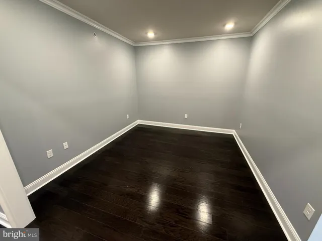 a bathroom with a sink vanity mirror and toilet