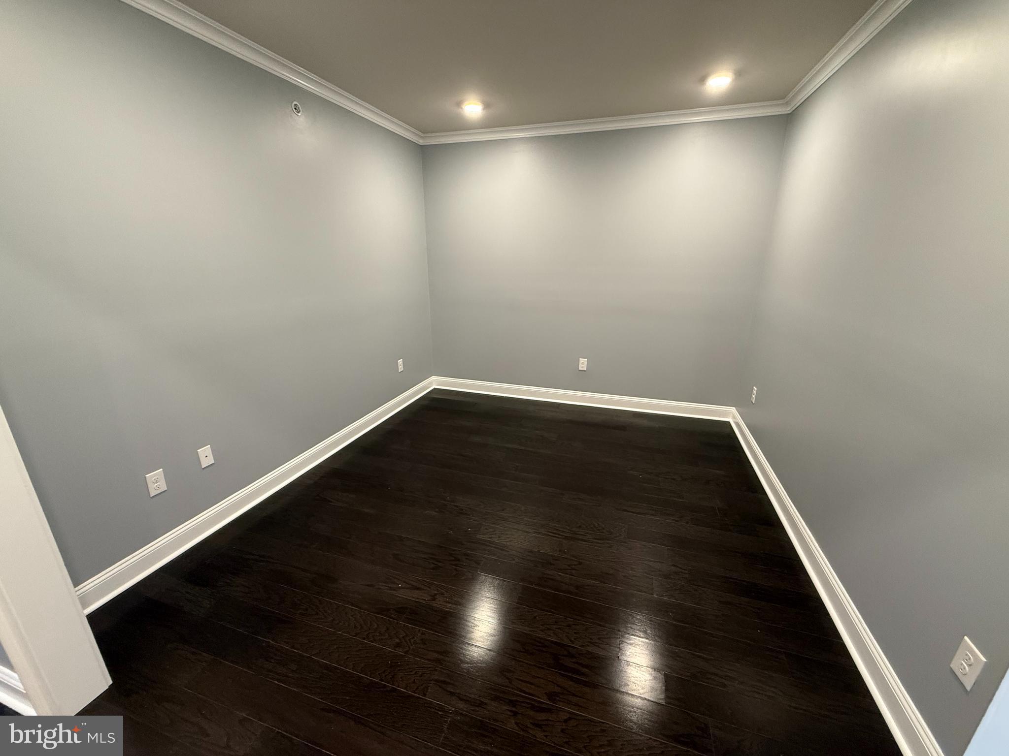 200 North Sycamore Street, Unit 2I Newtown, PA 18940 - Photo 14 of 27 an empty room with wooden floor and natural light