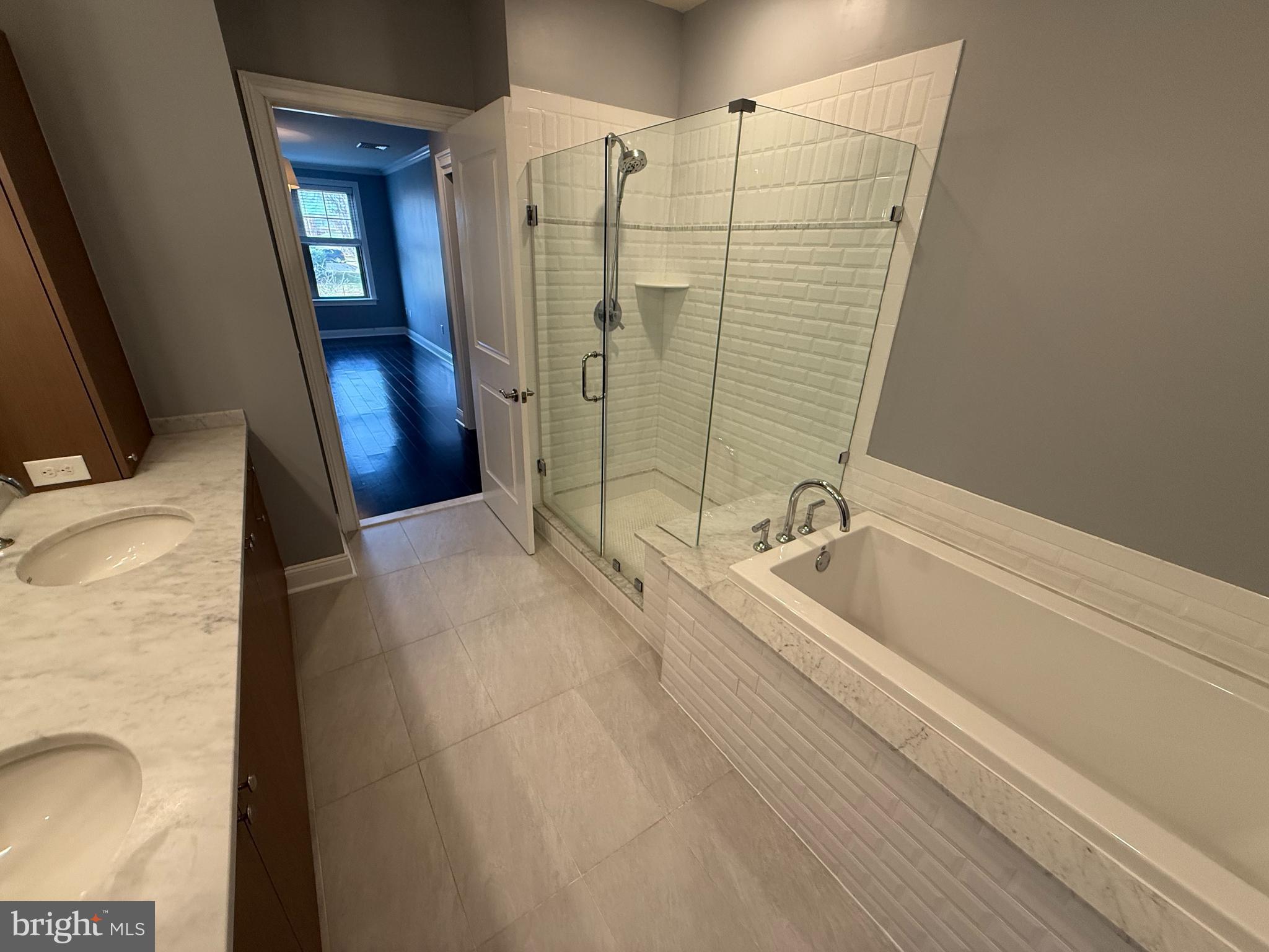 200 North Sycamore Street, Unit 2I Newtown, PA 18940 - Photo 18 of 27 a bathroom with a bathtub and a sink