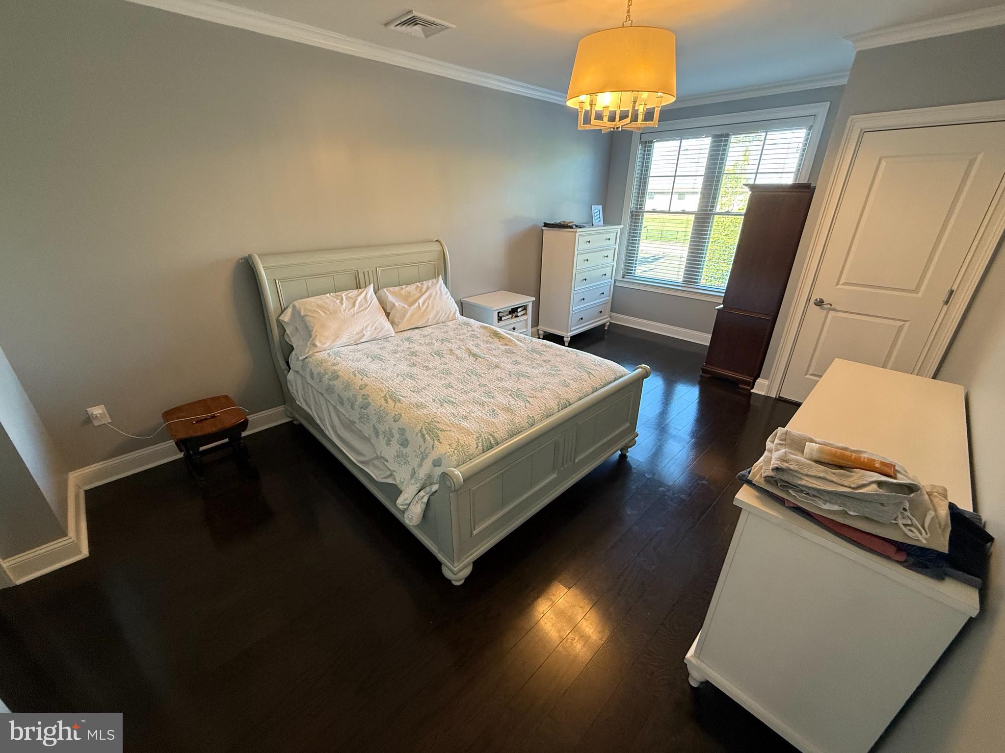 200 North Sycamore Street, Unit 2I Newtown, PA 18940 - Photo 8 of 27 a bed sitting in a bedroom next to a window