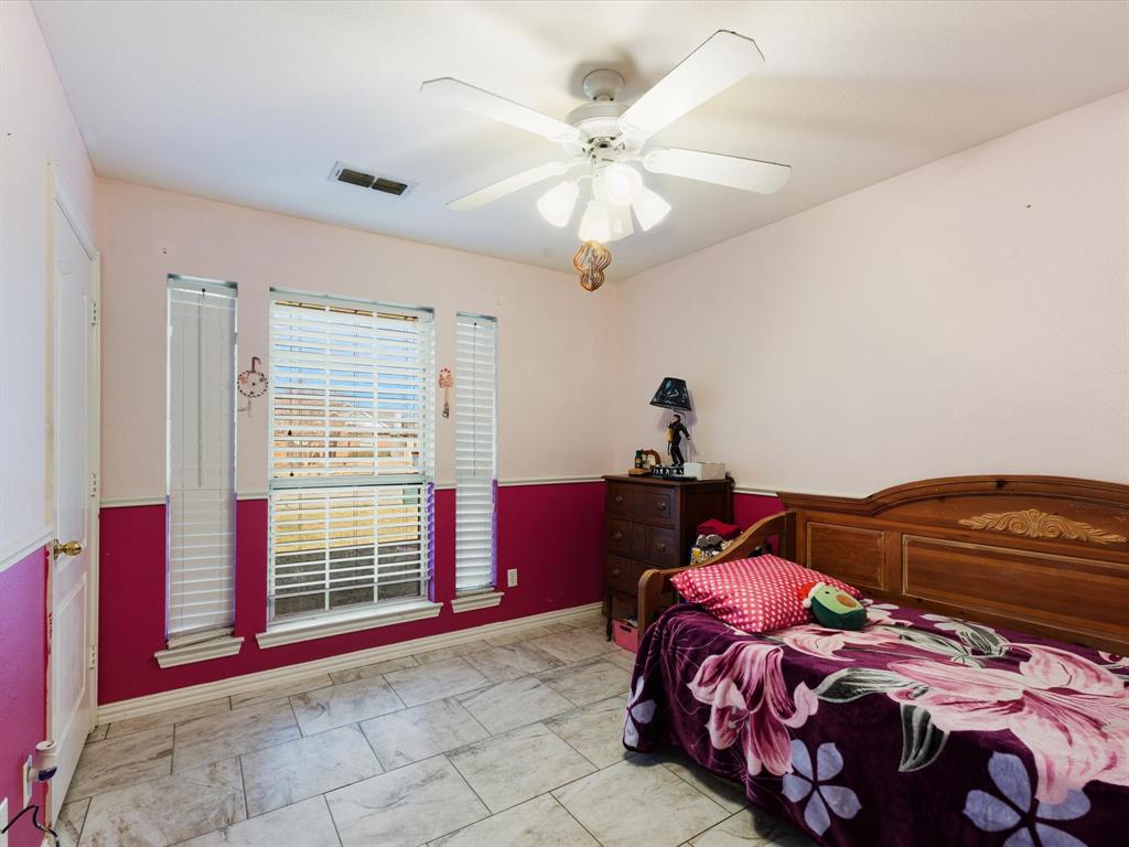 207 Quail Run Aubrey, TX 76227 - Photo 16 of 30 Bedroom with ceiling fan and baseboards