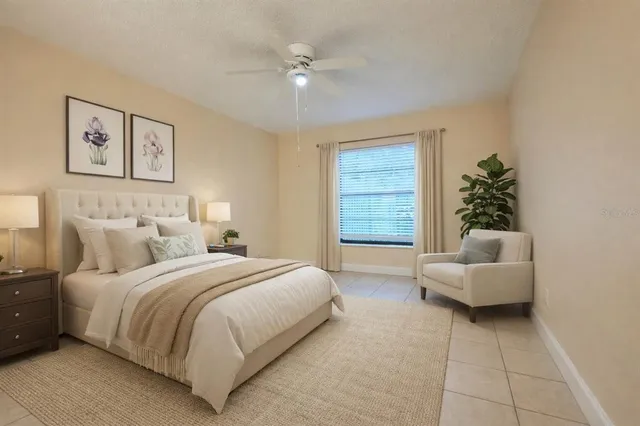 a bedroom with a bed and a couch