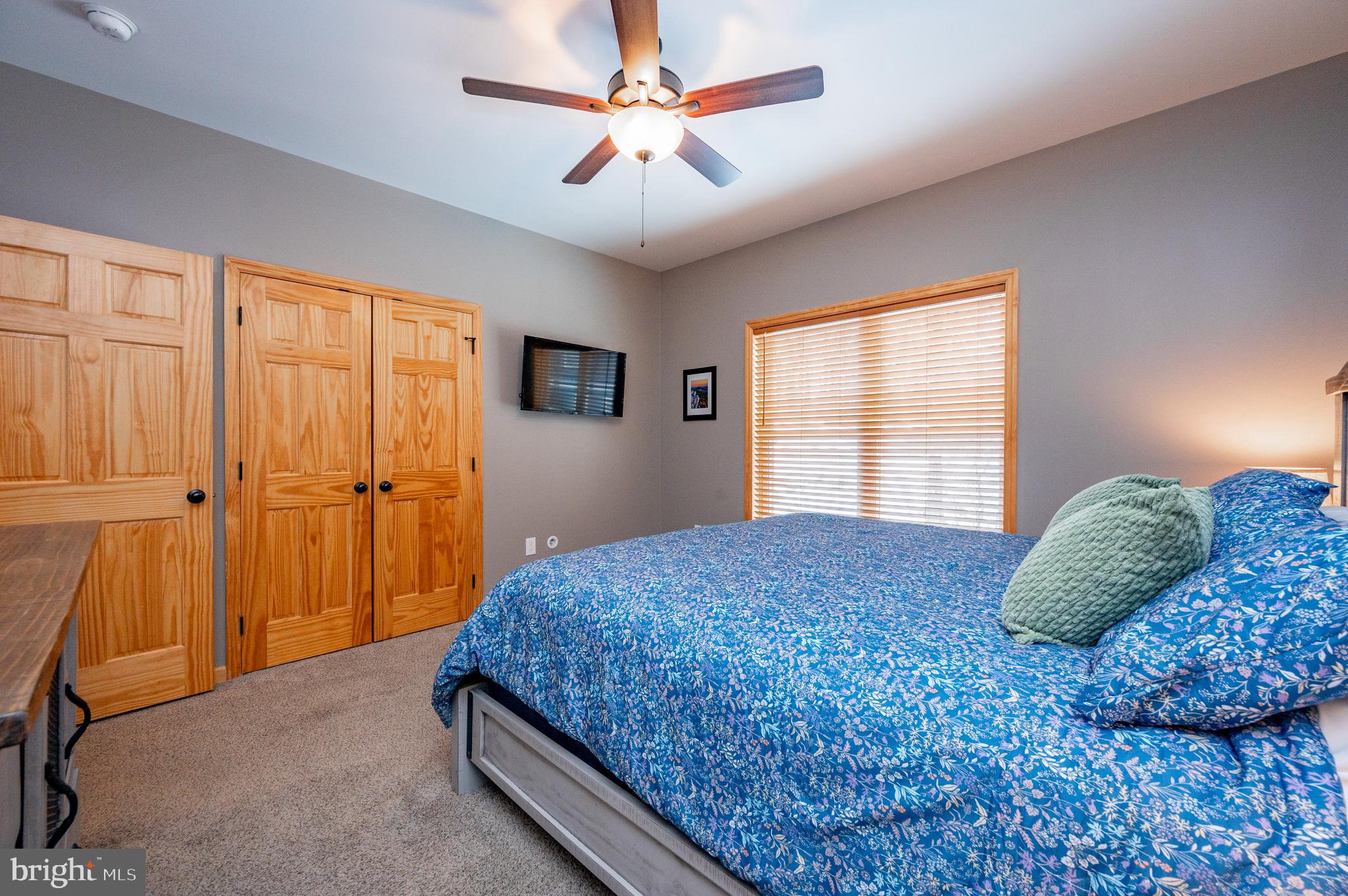 226 Wisp Adventure Road McHenry, MD 21541 - Photo 44 of 67 a bedroom with a large bed and a window