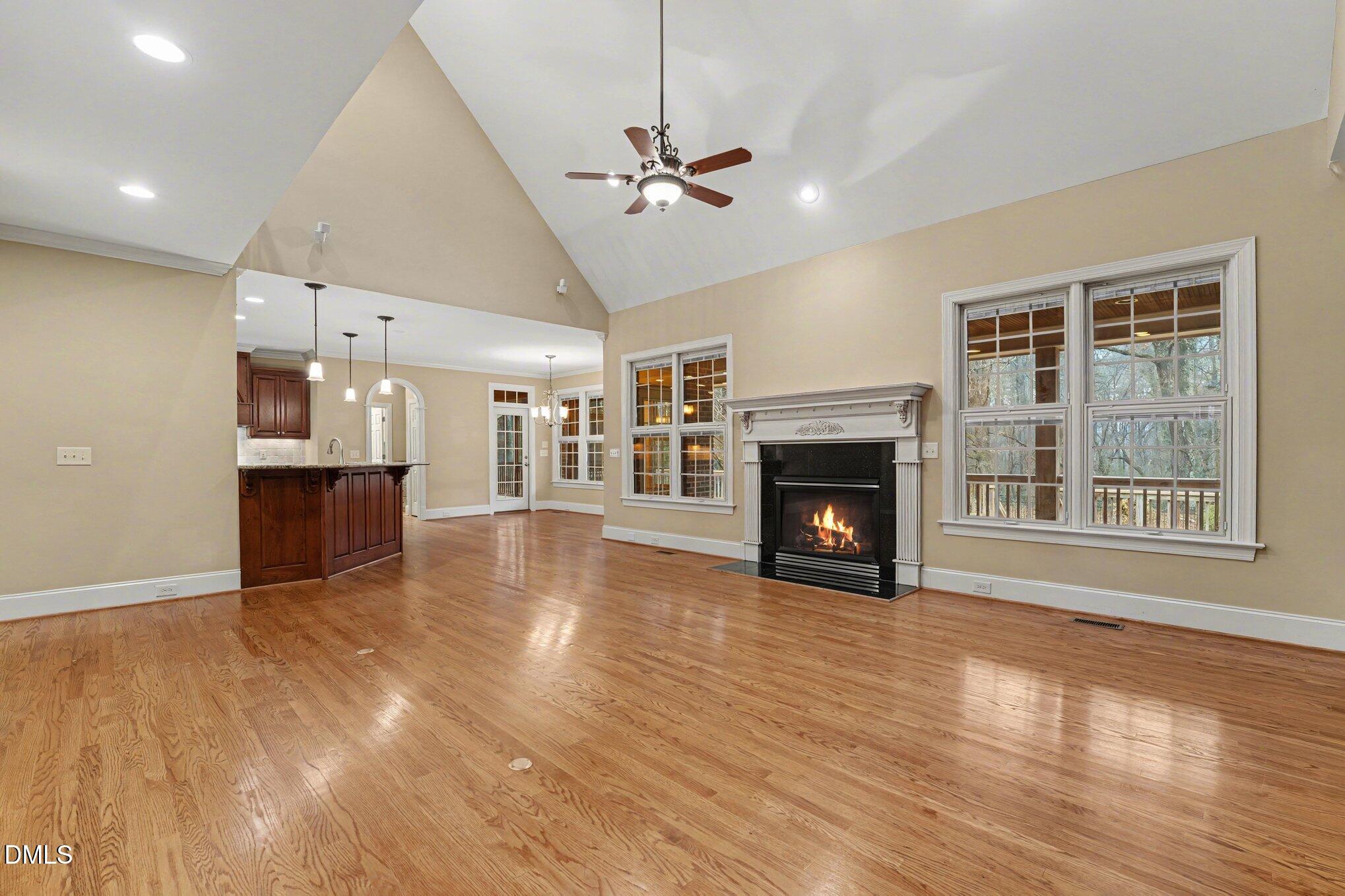 3104 Lake Wheeler Road Raleigh, NC 27603 - Photo 11 of 74 a view of a room with wooden floor and a fireplace