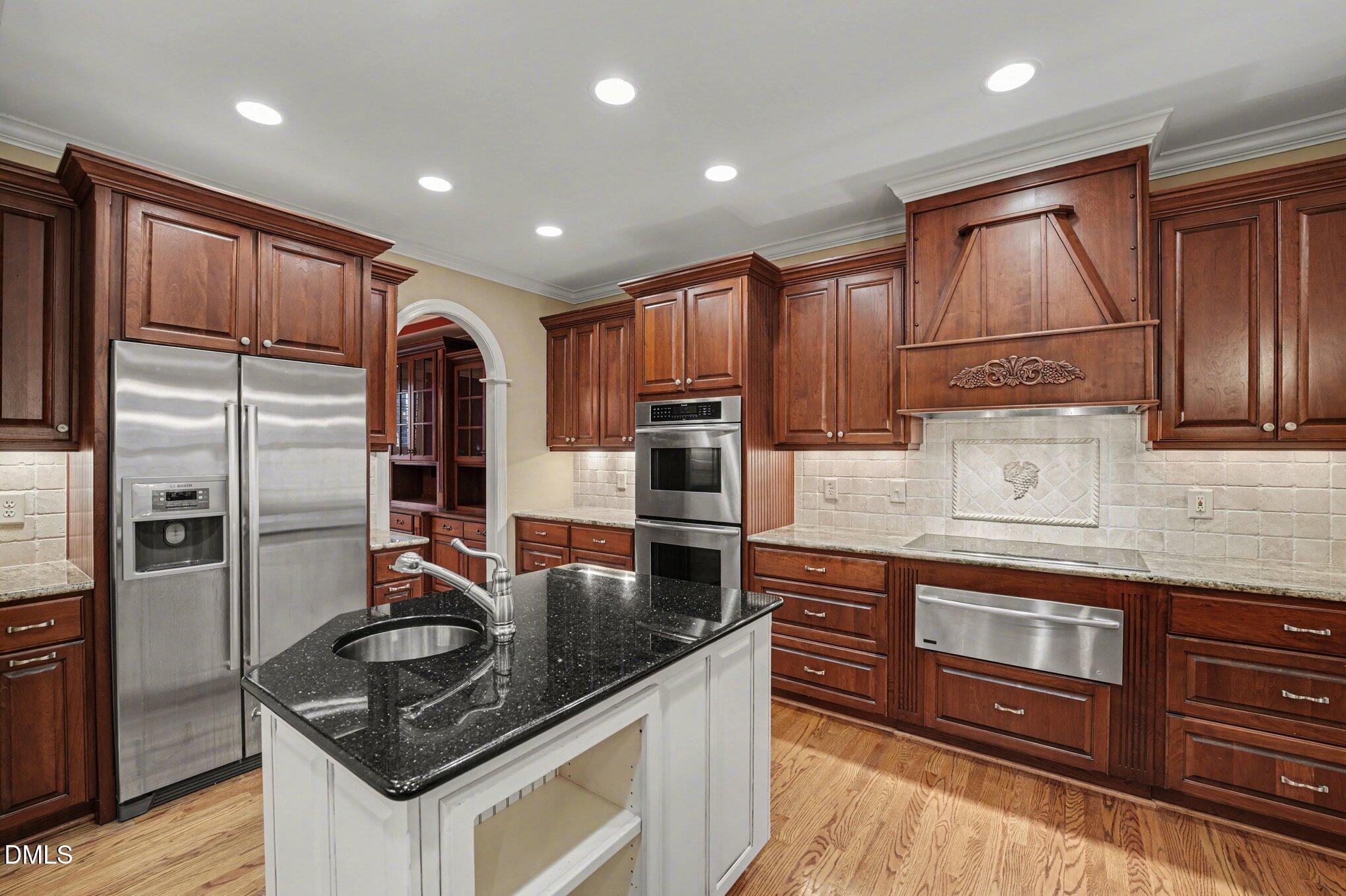 3104 Lake Wheeler Road Raleigh, NC 27603 - Photo 24 of 74 a kitchen with stainless steel appliances granite countertop a refrigerator stove and sink