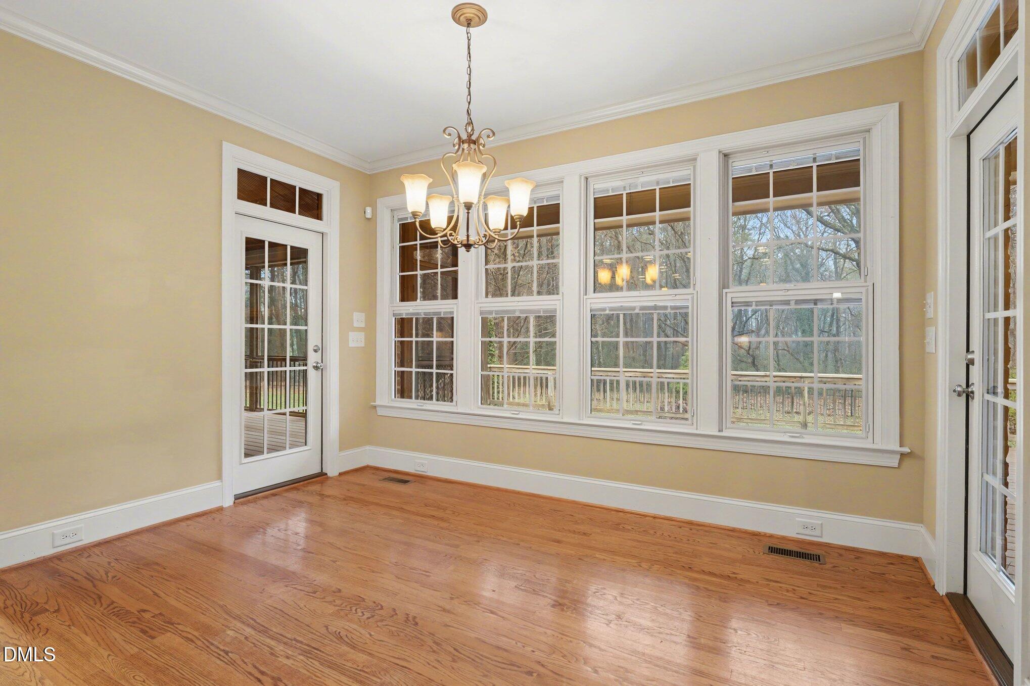 3104 Lake Wheeler Road Raleigh, NC 27603 - Photo 28 of 74 a view of an empty room with a window and wooden floor