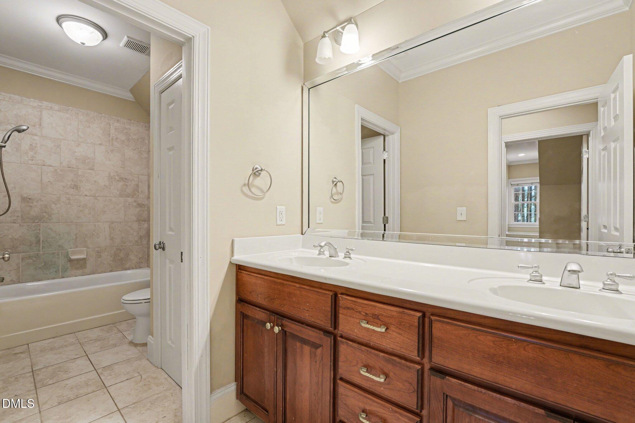 3104 Lake Wheeler Road Raleigh, NC 27603 - Photo 55 of 74 a bathroom with a sink a toilet and shower