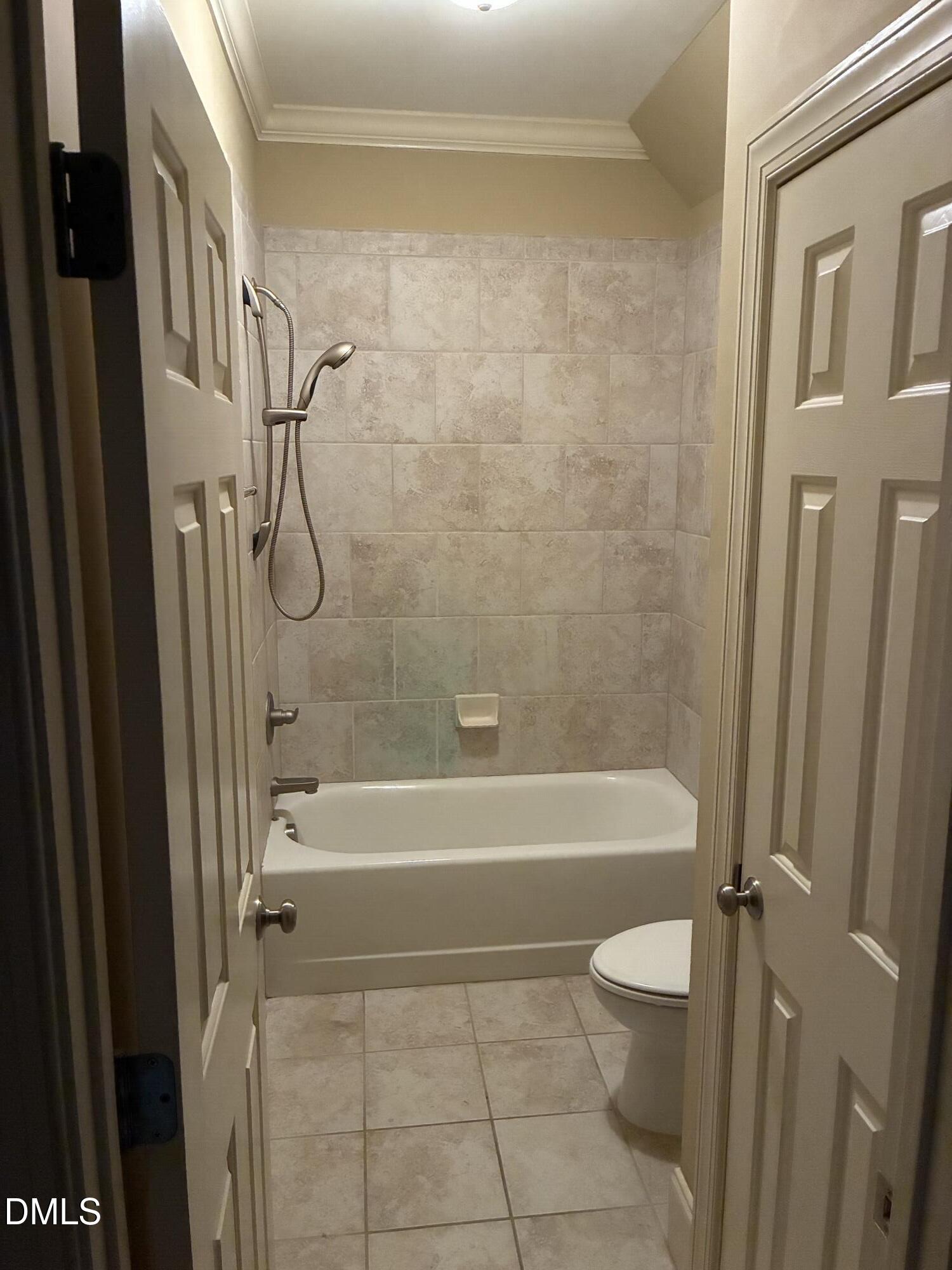 3104 Lake Wheeler Road Raleigh, NC 27603 - Photo 56 of 74 a bathroom with a bathtub a toilet and a shower