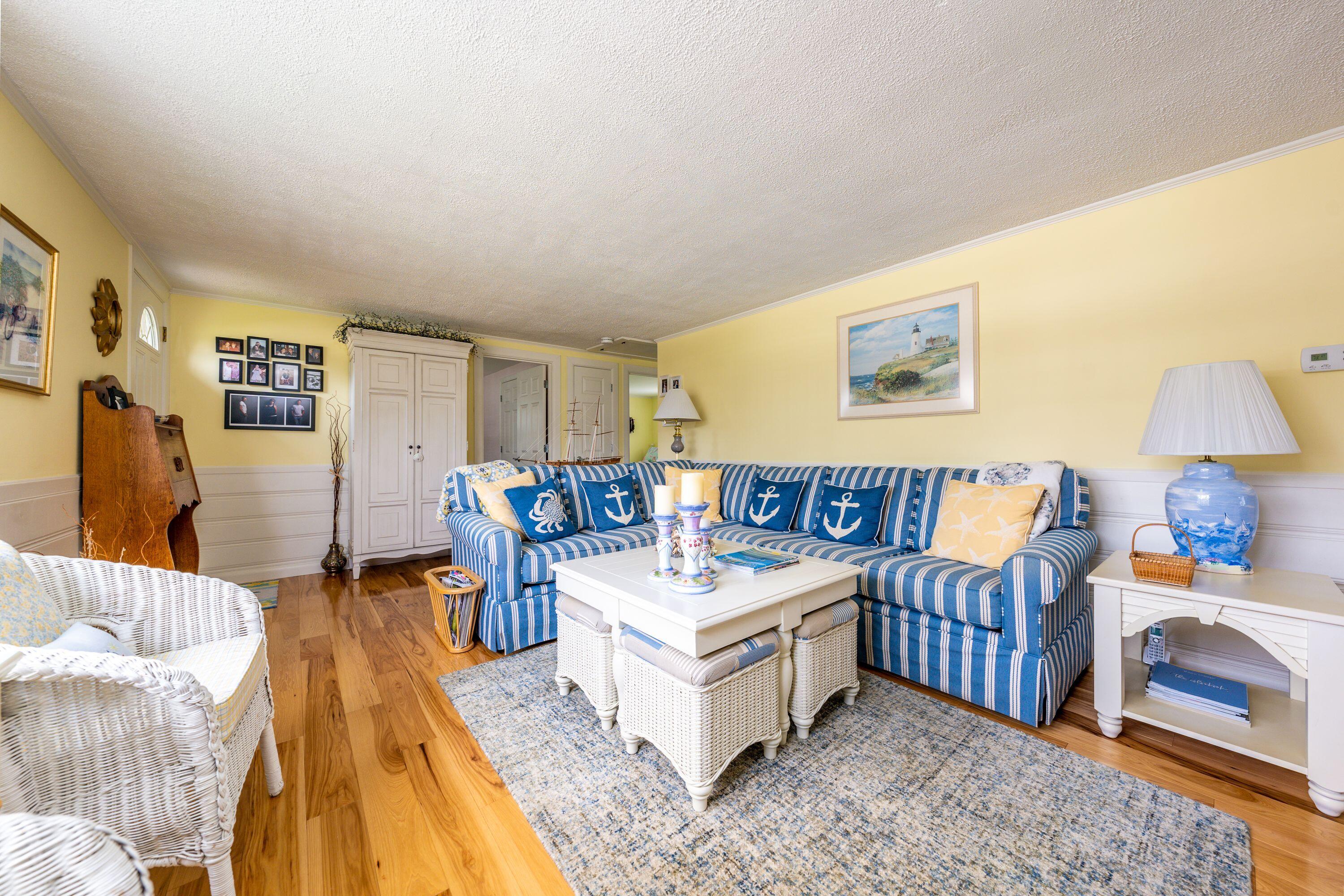 85 Surfside Road West Dennis, MA 02670 - Photo 14 of 34 a living room with furniture and a couch