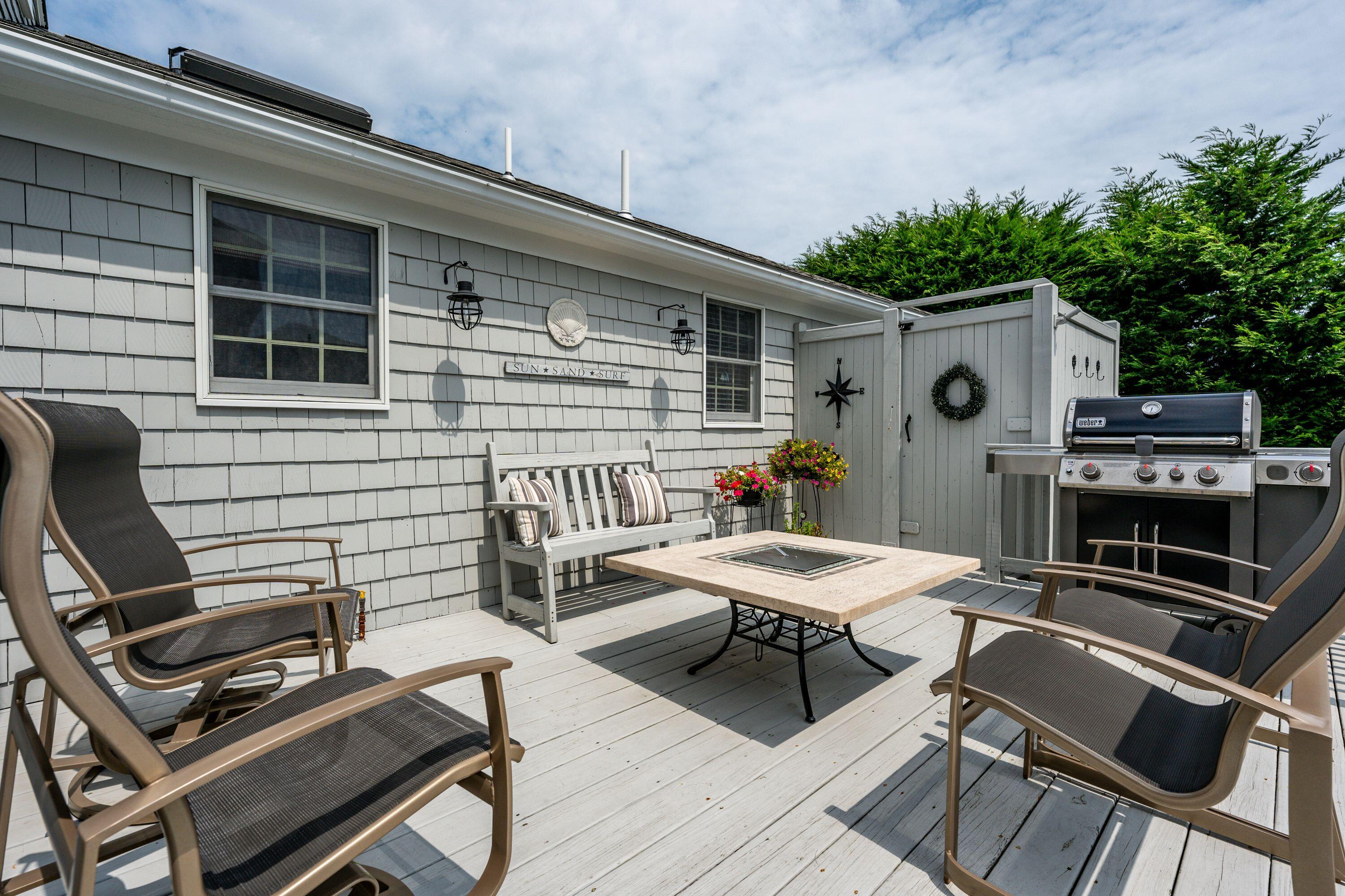 85 Surfside Road West Dennis, MA 02670 - Photo 25 of 34 a balcony with furniture and potted plants