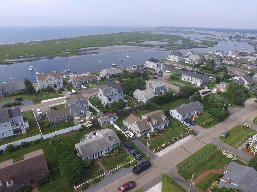 85 Surfside Road West Dennis, MA 02670 - Photo 4 of 34 an aerial view of a city with lots of residential buildings
