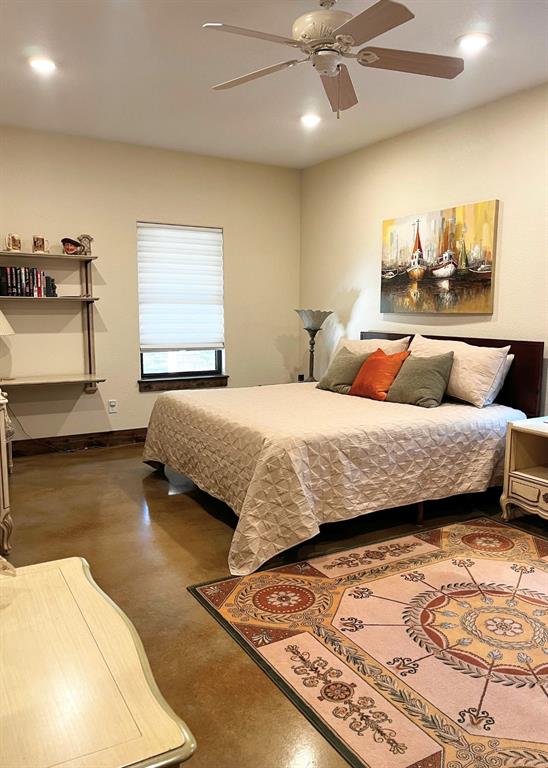 6601 Rash Court Granbury, TX 76049 - Photo 14 of 23 a bedroom with a bed and ceiling fan