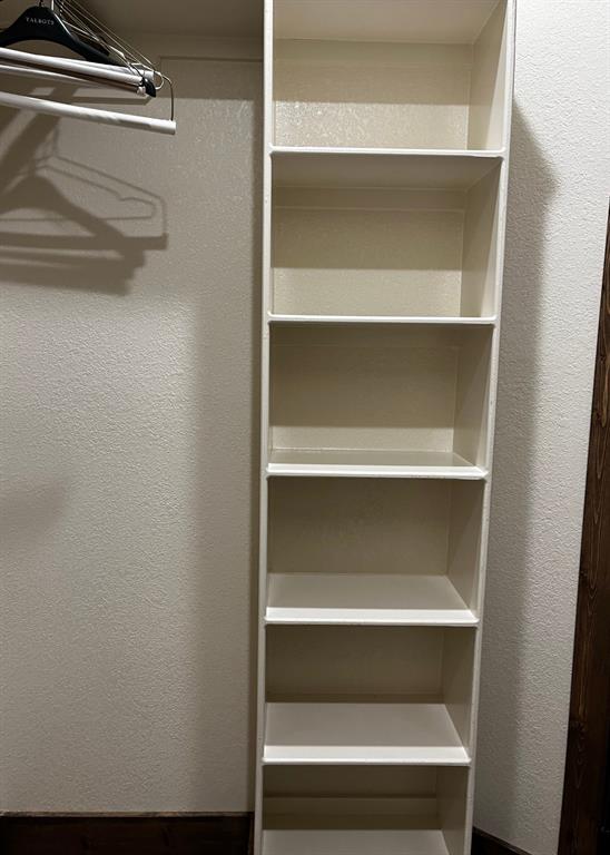 6601 Rash Court Granbury, TX 76049 - Photo 19 of 23 a view of walk in closet with empty racks