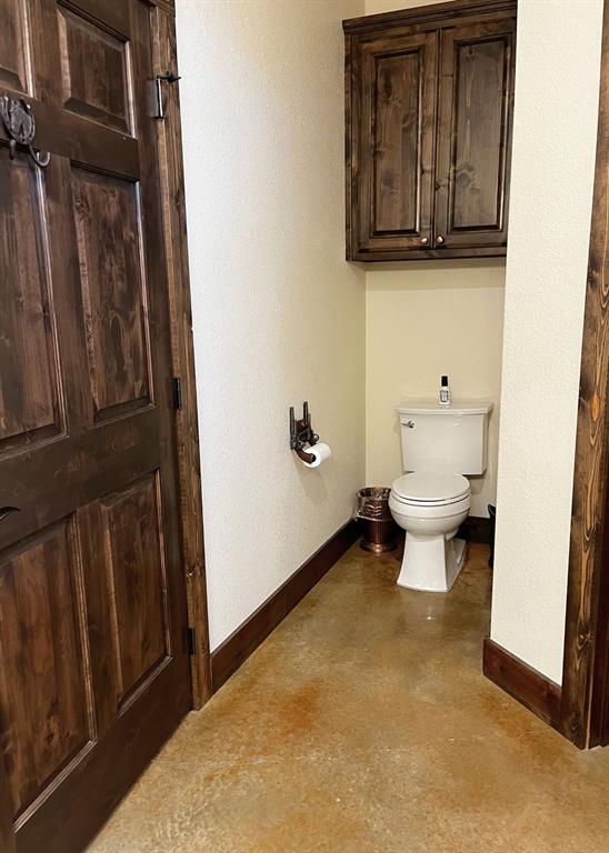6601 Rash Court Granbury, TX 76049 - Photo 20 of 23 a bathroom with a toilet