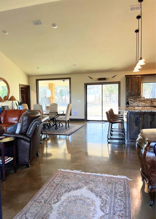 6601 Rash Court Granbury, TX 76049 - Photo 7 of 23 a living room with fireplace furniture and a large window