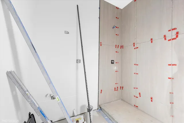 wooden floor with white walls