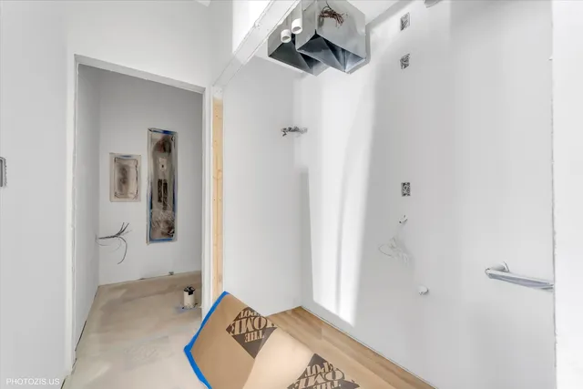 a view of a bathroom with a sink and mirror
