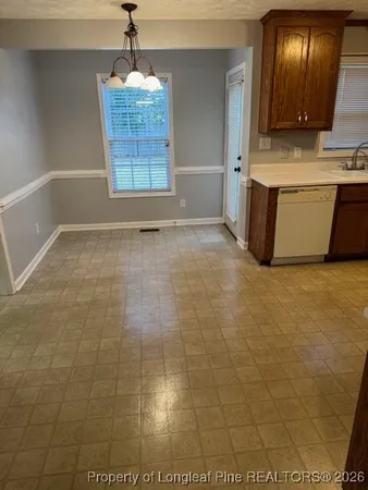 a view of a bathroom with a sink and a mirror