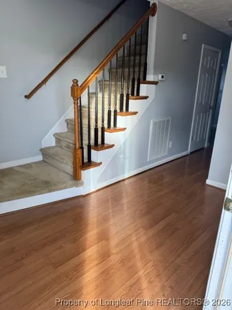 a view of entryway with wooden floor