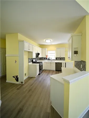a kitchen with a stove and a microwave