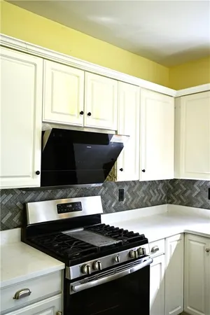 a kitchen with a stove and a microwave