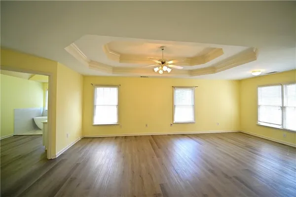 a view of an empty room with glass door